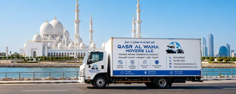 A Qasr Al Waha Movers truck in front of the Sheikh Zayed Grand Mosque in Abu Dhabi