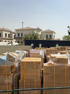 A full household consignment wrapped and banded on the driveway